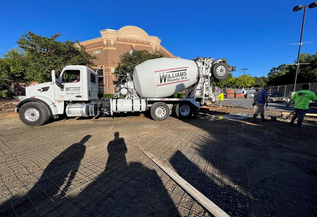A Concrete Mixer Truck Parked Outside of a Building